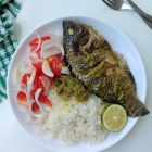 Baked tilapia with attieke and onion and tomato salad